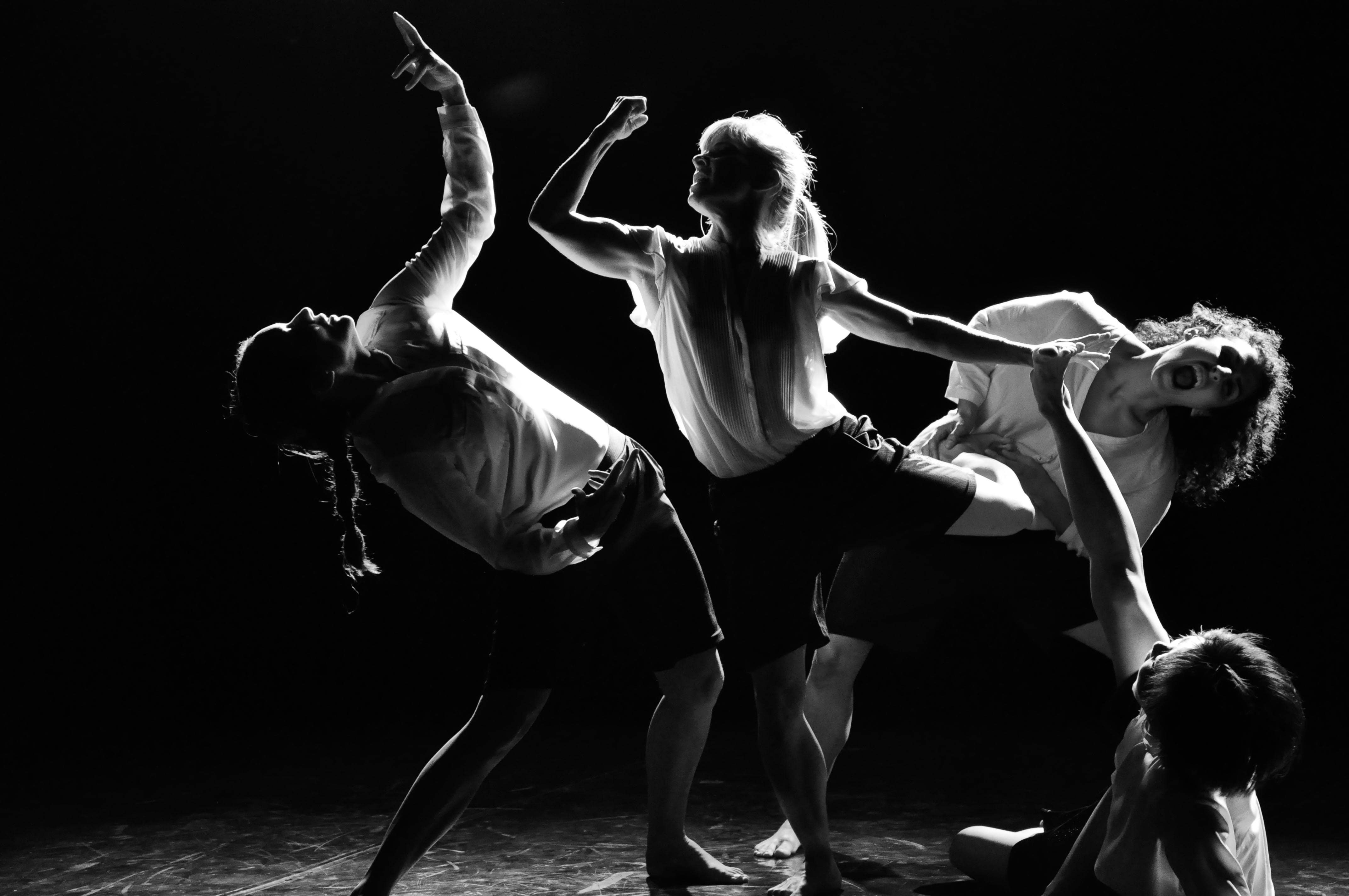 four dancers in a static pose